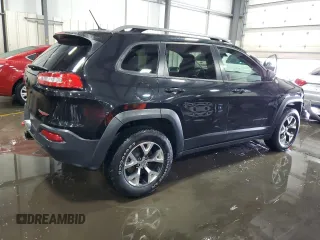2014 Jeep Cherokee Trailhawk with VIN 1C4PJMBSXEW187981, listed as a Copart auction lot 56711885 with 157,317 mi miles and Salvage title. Bid and sale history available at DreamBid. Image 3.