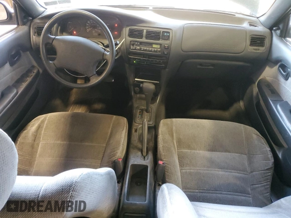1995 Toyota Corolla DX с VIN 2T1AE09B9SC116574, выставлен на аукционе Copart как лот 61986565 с пробегом 189 044 миль миль и Списание • Salvage title. История ставок и продаж доступна на DreamBid. Изображение 8.
