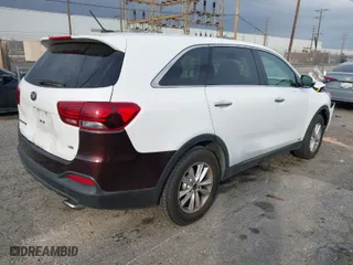 2019 Kia Sorento LX V6 with VIN 5XYPGDA54KG468077, listed as a IAAI auction lot 41556502 with 143,218 mi miles. Bid and sale history available at carsss.com. Image 4.