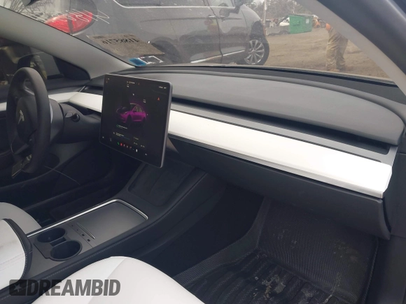2023 Tesla Model 3 Long Range with VIN 5YJ3E1EB6PF673532, listed as a IAAI auction lot 41885716 with 39,690 mi miles and . Bid and sale history available at DreamBid. Image 5.