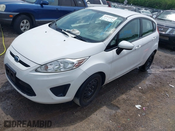 2013 Ford Fiesta S with VIN 3FADP4TJ4DM164594, listed as a IAAI auction lot 42154202 with 75,860 mi miles and . Bid and sale history available at DreamBid. Image 2.