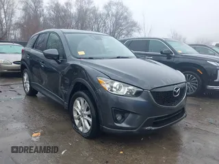 2014 Mazda CX-5 Grand Touring with VIN JM3KE4DY0E0392476, listed as a IAAI auction lot 41419144 with 89,245 mi miles and . Bid and sale history available at carsss.com. Image 1.