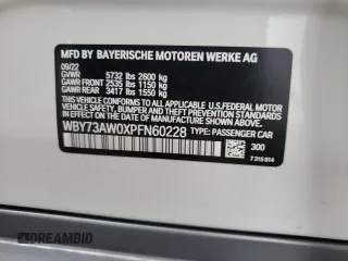 2023 BMW i4 eDrive40 with VIN WBY73AW0XPFN60228, listed as a Copart auction lot 61875624 with 21,597 mi miles and Salvage Title. Bid and sale history available at carsss.com. Image 12.