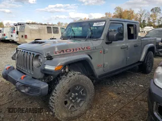 2020 Jeep Gladiator Mojave z VIN 1C6JJTEGXLL202735, wystawiony jako Copart lot #77430414 z przebiegiem Nie podano mil oraz Szkoda całkowita • Salvage title. Historia ofert i sprzedaży dostępna na DreamBid. Obrazek 1.