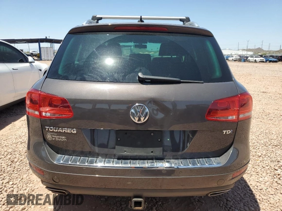 2012 Volkswagen Touareg Sport z VIN WVGFK9BPXCD003600, wystawiony jako Copart lot #61783705 z przebiegiem 171 598 mil mil oraz Czysty tytuł • Clean title. Historia ofert i sprzedaży dostępna na DreamBid. Obrazek 6.