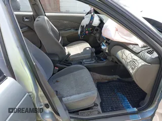 2003 Nissan Sentra XE z VIN 3N1CB51D43L714603, wystawiony jako IAAI lot #42392644 z przebiegiem 201 656 mil mil oraz . Historia ofert i sprzedaży dostępna na DreamBid. Obrazek 5.