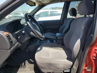 1999 Jeep Grand Cherokee Laredo z VIN 1J4G258SXXC518308, wystawiony jako Copart lot #56636235 z przebiegiem 233 649 mil mil oraz Szkoda całkowita • Salvage title. Historia ofert i sprzedaży dostępna na DreamBid. Obrazek 7.