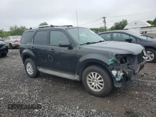2011 Mercury Mariner Premier z VIN 4M2CN9HG1BKJ00209, wystawiony jako Copart lot #57016475 z przebiegiem 224 019 mil mil oraz Szkoda całkowita • Salvage title. Historia ofert i sprzedaży dostępna na DreamBid. Obrazek 4.