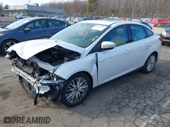 2018 Ford Focus Titanium z VIN 1FADP3J25JL293835, wystawiony jako IAAI lot #41877487 z przebiegiem 109 211 mil mil oraz . Historia ofert i sprzedaży dostępna na DreamBid. Obrazek 2.