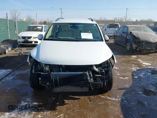 2016 Volkswagen Tiguan SE with VIN WVGBV7AX0GW018760, listed as a IAAI auction lot 41733586 with 60,743 mi miles and . Bid and sale history available at DreamBid. Image 13.