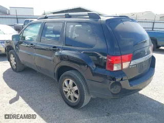 2011 Mitsubishi Endeavor LS with VIN 4A4JN2AS0BE026338, listed as a IAAI auction lot 41703458 with 140,986 mi miles. Bid and sale history available at carsss.com. Image 3.