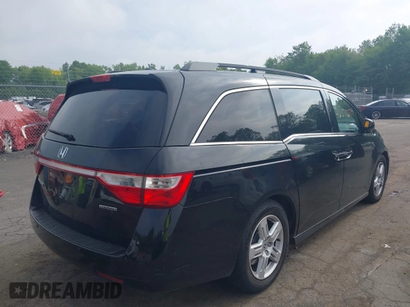 2011 Honda Odyssey Touring with VIN 5FNRL5H93BB104906, listed as a IAAI auction lot 42371279 with 183,856 mi miles and . Bid and sale history available at DreamBid. Image 4.