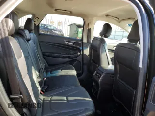 2015 Ford Edge Titanium z VIN 2FMTK3K91FBB52506, wystawiony jako Copart lot #84192474 z przebiegiem 136 437 mil mil oraz Nie do naprawy • Non repairable. Historia ofert i sprzedaży dostępna na DreamBid. Obrazek 11.