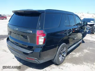 2021 Chevrolet Tahoe Z71 with VIN 1GNSKPKD2MR124128, listed as a IAAI auction lot 41874524 with 75,066 mi miles. Bid and sale history available at carsss.com. Image 4.