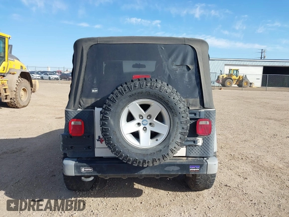 2005 Jeep Wrangler Sport with VIN 1J4FA49SX5P336380, listed as a IAAI auction lot 41752554 with 139,004 mi miles. Bid and sale history available at carsss.com. Image 16.