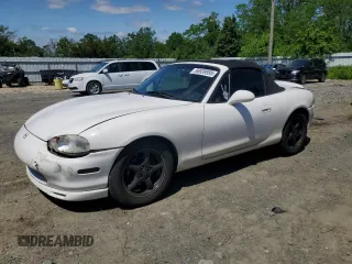 1999 Mazda MX-5 Miata z VIN JM1NB3533X0100298, wystawiony jako Copart lot #56939995 z przebiegiem 156 604 mil mil oraz Szkoda całkowita • Salvage title. Historia ofert i sprzedaży dostępna na DreamBid. Obrazek 1.