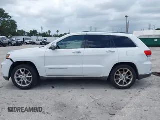 2014 Jeep Grand Cherokee Summit z VIN 1C4RJEJG1EC357948, wystawiony jako IAAI lot #42498652 z przebiegiem 213 715 mil mil oraz . Historia ofert i sprzedaży dostępna na DreamBid. Obrazek 14.