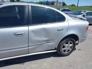 2004 Oldsmobile Alero GL1 z VIN 1G3NL52E04C197517, wystawiony jako IAAI lot #42315934 z przebiegiem Nie podano mil oraz . Historia ofert i sprzedaży dostępna na DreamBid. Obrazek 6.