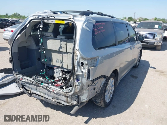 2012 Toyota Sienna XLE AAS with VIN 5TDYK3DC7CS185555, listed as a IAAI auction lot 42013098 with 140,969 mi miles. Bid and sale history available at carsss.com. Image 4.