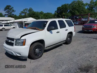 2011 Chevrolet Tahoe Commercial with VIN 1GNLC2E04BR293125, listed as a IAAI auction lot 42476037 with 123,666 mi miles and . Bid and sale history available at DreamBid. Image 2.