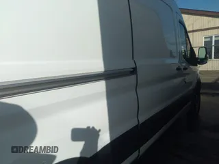 2019 Ford Transit with VIN 1FTYE2CM9KKB09353, listed as a IAAI auction lot 38121359 with 131,124 mi miles and . Bid and sale history available at DreamBid. Image 13.