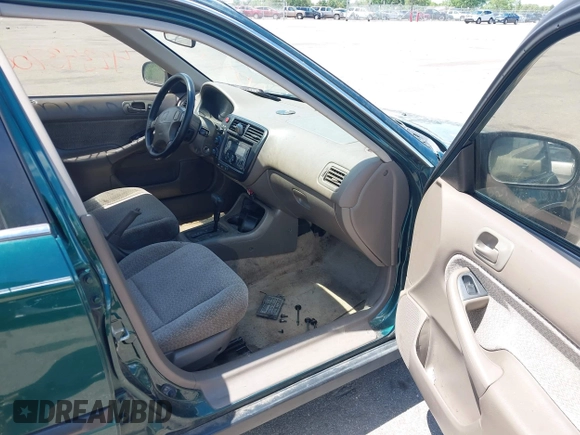 1999 Honda Civic LX z VIN 1HGEJ6672XL044666, wystawiony jako IAAI lot #42343700 z przebiegiem 144 445 mil mil oraz . Historia ofert i sprzedaży dostępna na DreamBid. Obrazek 5.