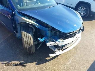 2021 Tesla Model 3 Long Range with VIN 5YJ3E1EB6MF990089, listed as a IAAI auction lot 41607316 with 25,223 mi miles and . Bid and sale history available at DreamBid. Image 6.
