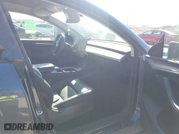 2023 Tesla Model Y Long Range with VIN 7SAYGAEE8PF667728, listed as a IAAI auction lot 41839771 with 32,654 mi miles and . Bid and sale history available at DreamBid. Image 5.