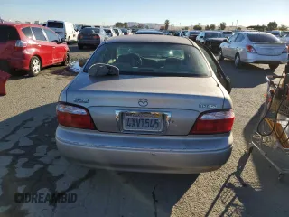 2002 Mazda 626 LX with VIN 1YVGF22C125297148, listed as a Copart auction lot 79130024 with 138,408 mi miles and Salvage Title. Bid and sale history available at carsss.com. Image 6.