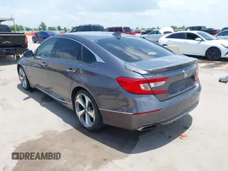 2019 Honda Accord Touring with VIN 1HGCV2F93KA013002, listed as a IAAI auction lot 42519920 with 76,841 mi miles and . Bid and sale history available at DreamBid. Image 3.