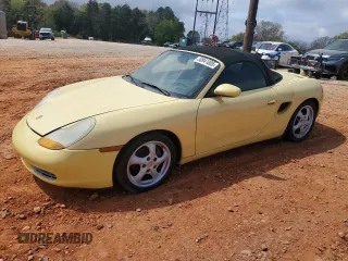 1998 Porsche Boxster z VIN WP0CA2982WU623104, wystawiony jako Copart lot #50941005 z przebiegiem 78 486 mil mil oraz Czysty tytuł • Clean title. Historia ofert i sprzedaży dostępna na DreamBid. Obrazek 1.