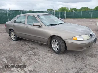 2001 Mazda 626 LX z VIN 1YVGF22DX15246285, wystawiony jako IAAI lot #42157656 z przebiegiem 213 070 mil mil oraz . Historia ofert i sprzedaży dostępna na DreamBid. Obrazek 1.