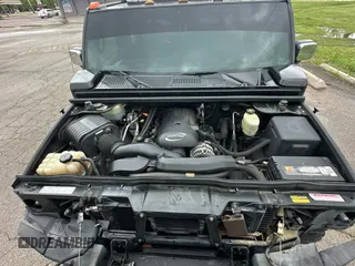 2005 Hummer H2 SUT z VIN 5GRGN22U15H123289, wystawiony jako Copart lot #55254575 z przebiegiem 161 105 mil mil oraz Tytuł czysty. Historia ofert i sprzedaży dostępna na DreamBid. Obrazek 7.