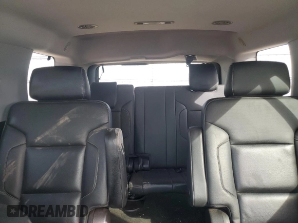 2018 Chevrolet Tahoe Premier with VIN 1GNSKCKC5JR196310, listed as a Copart auction lot 48050205 with 101,300 mi miles and Salvage title. Bid and sale history available at DreamBid. Image 10.