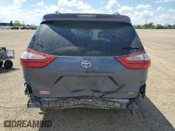 2015 Toyota Sienna XLE with VIN 5TDYK3DC4FS619385, listed as a Copart auction lot 57090385 with 112,896 mi miles and Salvage title. Bid and sale history available at DreamBid. Image 6.