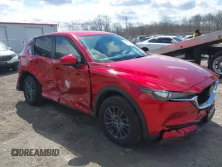 2021 Mazda CX-5 Touring z VIN JM3KFBCM1M0401717, wystawiony jako IAAI lot #42036407 z przebiegiem 35 587 mil mil oraz . Historia ofert i sprzedaży dostępna na DreamBid. Obrazek 1.