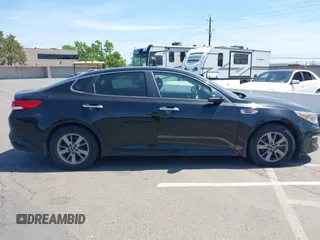 2016 Kia Optima LX Turbo with VIN 5XXGT4L12GG077169, listed as a IAAI auction lot 42108788 with 116,589 mi miles. Bid and sale history available at carsss.com. Image 13.