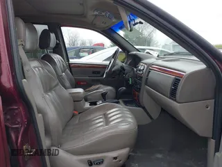 1999 Jeep Grand Cherokee Limited with VIN 1J4GW68N5XC642670, listed as a IAAI auction lot 41990199 with 154,492 mi miles. Bid and sale history available at carsss.com. Image 5.