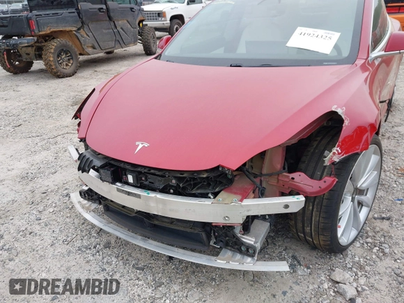 2018 Tesla Model 3 Long Range Battery with VIN 5YJ3E1EB7JF055384, listed as a IAAI auction lot 41924325 with 52,039 mi miles and . Bid and sale history available at DreamBid. Image 6.