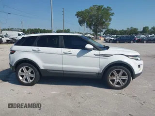 2015 Land Rover Range Rover Evoque Pure Premium z VIN SALVR2BG0FH964683, wystawiony jako IAAI lot #42016766 z przebiegiem 94 942 mil mil oraz . Historia ofert i sprzedaży dostępna na DreamBid. Obrazek 13.