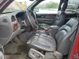 2003 GMC Envoy SLE with VIN 1GKDT13S332136423, listed as a Copart auction lot 49301635 with 148,669 mi miles and Salvage Title. Bid and sale history available at carsss.com. Image 7.