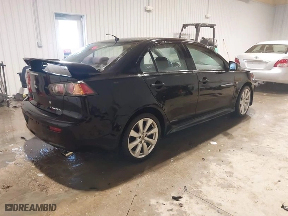 2012 Mitsubishi Lancer GT with VIN JA32U8FW7CU013282, listed as a IAAI auction lot 41597632 with 153134 miles. Bid and sale history available at carsss.com. Image 4.