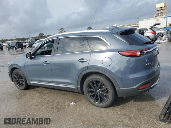 2021 Mazda CX-9 Grand Touring z VIN JM3TCADYXM0519757, wystawiony jako Copart lot #86665134 z przebiegiem 51 217 mil mil oraz Szkoda całkowita • Salvage title. Historia ofert i sprzedaży dostępna na DreamBid. Obrazek 2.
