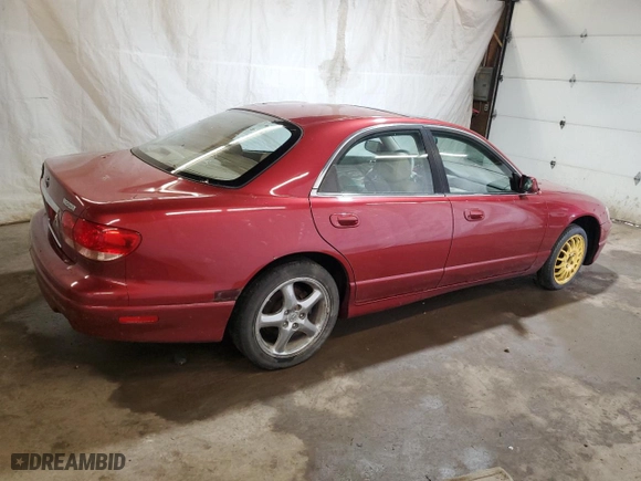 2001 Mazda Millenia S with VIN JM1TA222111707236, listed as a Copart auction lot 54690874 with NaN miles and Salvage Title. Bid and sale history available at carsss.com. Image 3.