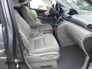 2014 Honda Odyssey Touring with VIN 5FNRL5H97EB114634, listed as a IAAI auction lot 42105220 with Not Provided miles and . Bid and sale history available at carsss.com. Image 5.
