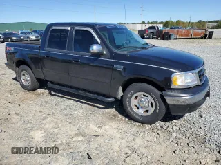2001 Ford F-150 XLT with VIN 1FTRW07W11KE08545, listed as a Copart auction lot 49869415 with 264,349 mi miles and Salvage title. Bid and sale history available at DreamBid. Image 4.