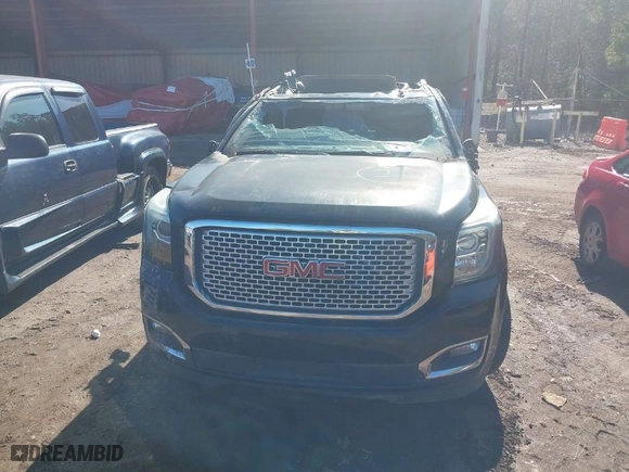 2016 GMC Yukon Denali with VIN 1GKS1CKJ2GR128618, listed as a IAAI auction lot 40009657 with 175,776 mi miles. Bid and sale history available at carsss.com. Image 6.