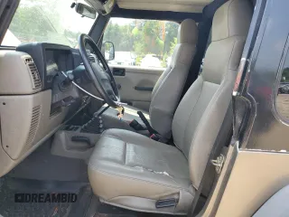 2004 Jeep Wrangler SE with VIN 1J4FA29164P797604, listed as a Copart auction lot 59978155 with 166,888 mi miles and Clean title. Bid and sale history available at DreamBid. Image 7.