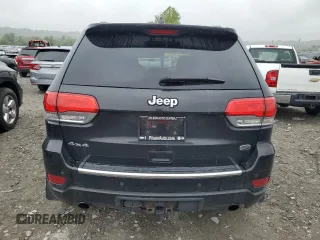 2015 Jeep Grand Cherokee Overland with VIN 1C4RJFCT2FC762573, listed as a Copart auction lot 59123275 with 229,128 mi miles and Salvage title. Bid and sale history available at DreamBid. Image 6.