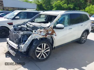 2016 Honda Pilot Touring with VIN 5FNYF6H97GB088824, listed as a IAAI auction lot 41991803 with 84,761 mi miles. Bid and sale history available at carsss.com. Image 2.